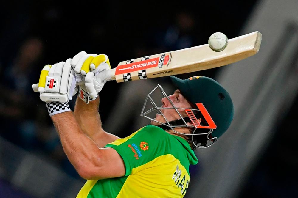 Australia’s Mitchell Marsh plays a shot during the ICC men’s Twenty20 World Cup final match against New Zealand at the Dubai International Cricket Stadium. – AFPPIX