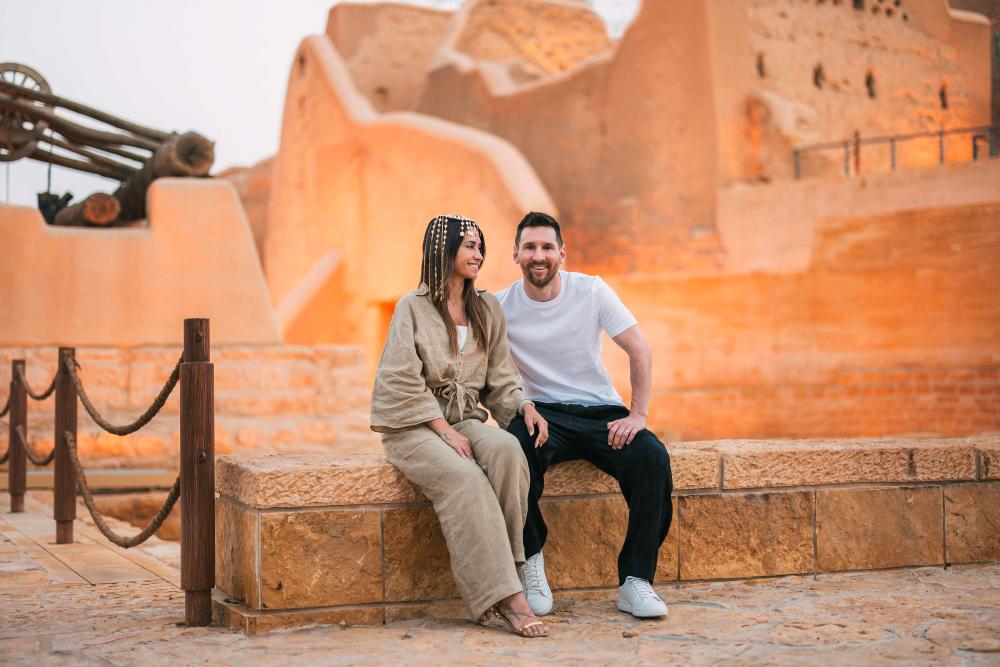 This handout picture provided by the Saudi Tourism Authority on May 1, 2023, shows Argentina's forward Lionel Messi, his wife Antonela Roccuzzo visiting Diriyah near Riyadh. AFPPIX