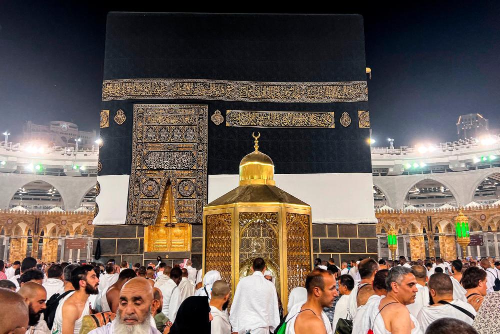 Muslim worshippers and pilgrims gather around the Kaaba, Islam's holiest shrine, at the Grand Mosque in the holy city of Mecca on June 22, 2023, as they arrive for the annual Hajj pilgrimage. AFPPIX