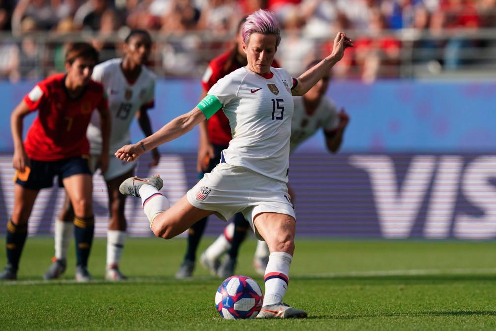 United States' forward Megan Rapinoe scores a goal during the France 2019 Women's World Cup round of sixteen football match between Spain and USA, on June 24, 2019, at the Auguste-Delaune stadium in Reims, France. - AFP