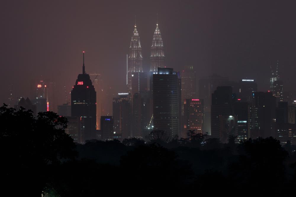 The skyline of Kuala Lumpur is blanketed by haze on September 18, 2019. - AFP