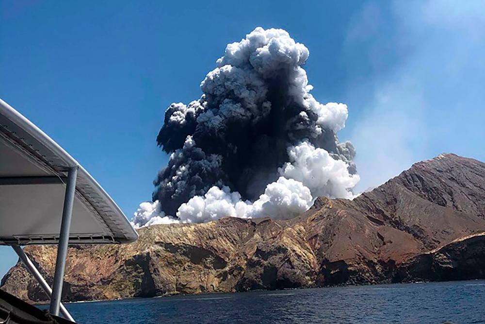 This handout photo taken on December 9, 2019 and provided courtesy of Lillani Hopkins through her Facebook account on Dec 12 shows a plume of ash rising into the air as the volcano on White Island erupts off the coast of Whakatane on New Zealand's North Island. - AFP