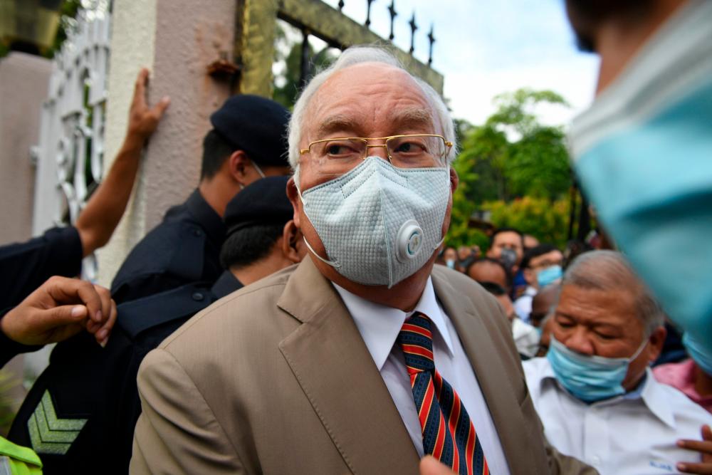 Former prime minister Datuk Seri Najib Abdul Razak arrives at the Duta Court complex awaiting a verdict in his corruption trial in Kuala Lumpur on July 28, 2020. - AFP