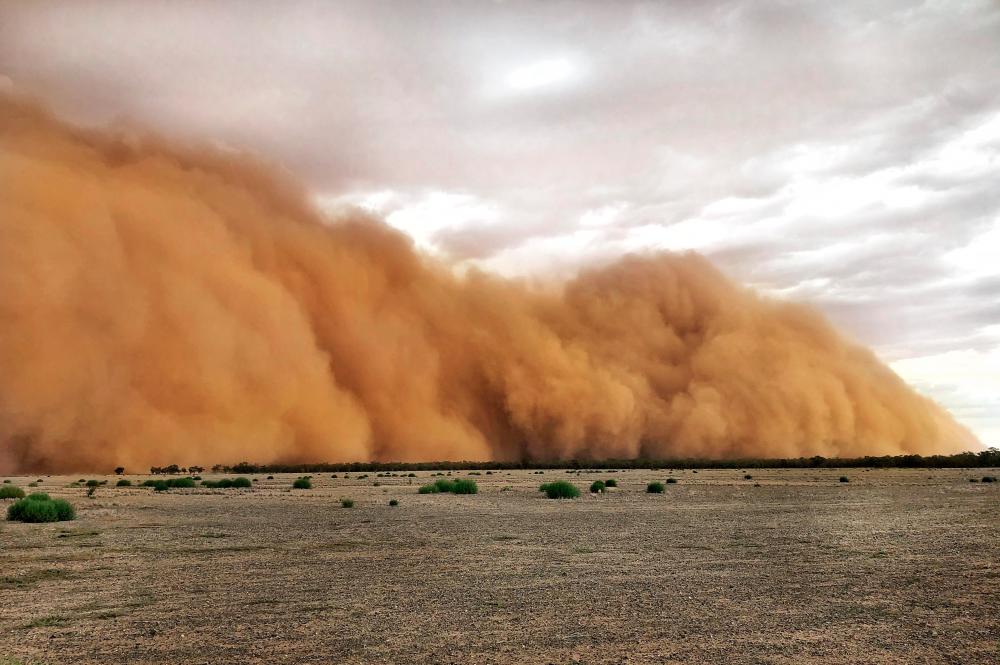 This handout photo taken on Jan 17, and received on Jan 20 courtesy of Marcia Macmillan shows a dust storm in Mullengudgery in New South Wales. — AFP
