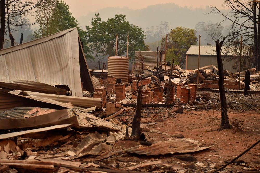 The remains of a property destroyed by fire is seen in Bobin, 350km north of Sydney on Nov 9, 2019, as firefighters try to contain dozens of out-of-control blazes that are raging in the state of New South Wales. — AFP