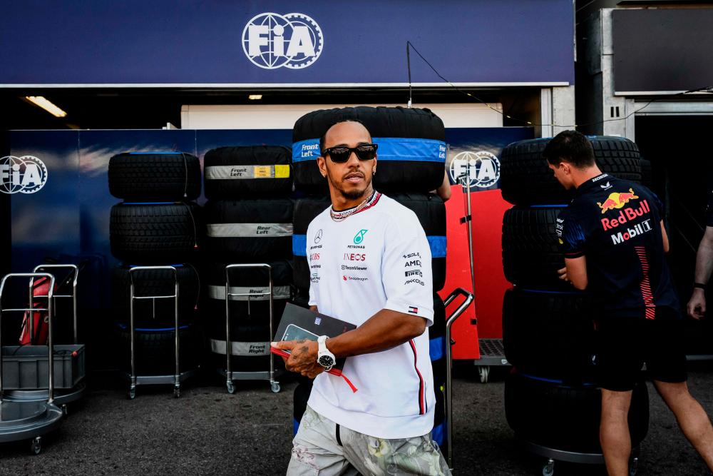 Mercedes’ British driver Lewis Hamilton walks in the pit lane ahead of the Monaco Formula One Grand Prix at the Monaco street circuit in Monaco on May 25, 2023/AFPPix