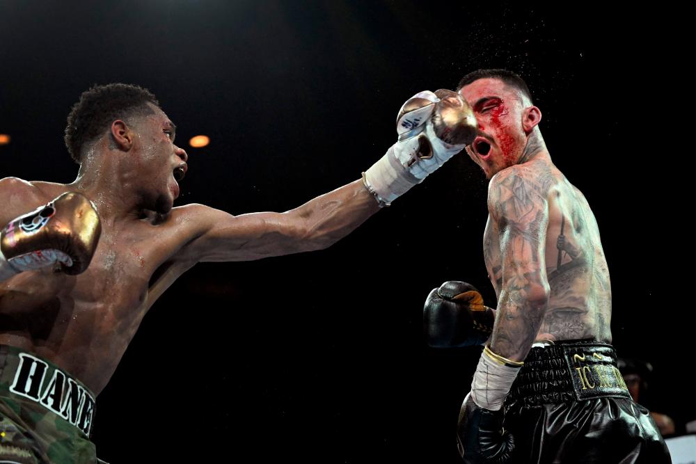 Devin Haney of the US (L) and George Kambosos of Australia box during their bout for undisputed lightweight world boxing champion in Melbourne on October 16, 2022. AFPPIX