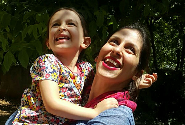 A handout picture released by the Free Nazanin campaign on August 23, 2018 shows Nazanin Zaghari-Ratcliffe (R) embracing her daughter Gabriella in Damavand, Iran. — AFP