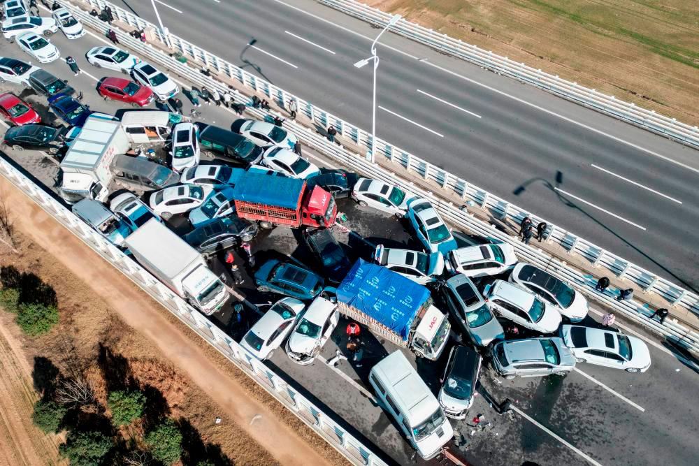 Filepix: This aerial photo taken on December 28, 2022 shows a multi-vehicle collision on Zhengxin Yellow River Bridge in Zhengzhou, in China’s central Henan province/AFPPix
