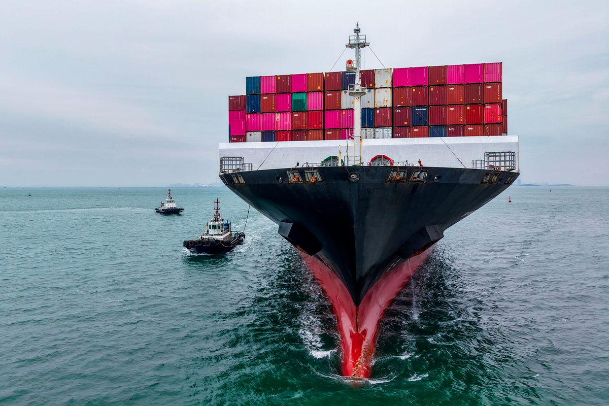 A cargo ship sails into the port in Qingdao, in China’s eastern Shandong province on October 13, 2025. - China OUT via AFPPIX