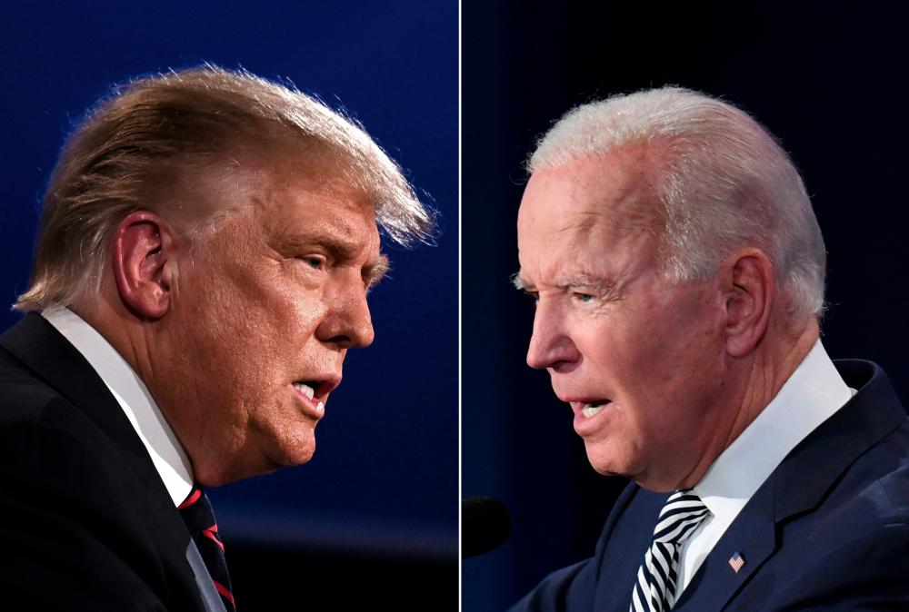 This combination of pictures created on September 29, 2020 shows US President Donald Trump (L) and Democratic Presidential candidate former Vice President Joe Biden squaring off during the first presidential debate at the Case Western Reserve University and Cleveland Clinic in Cleveland, Ohio on September 29, 2020. — AFP