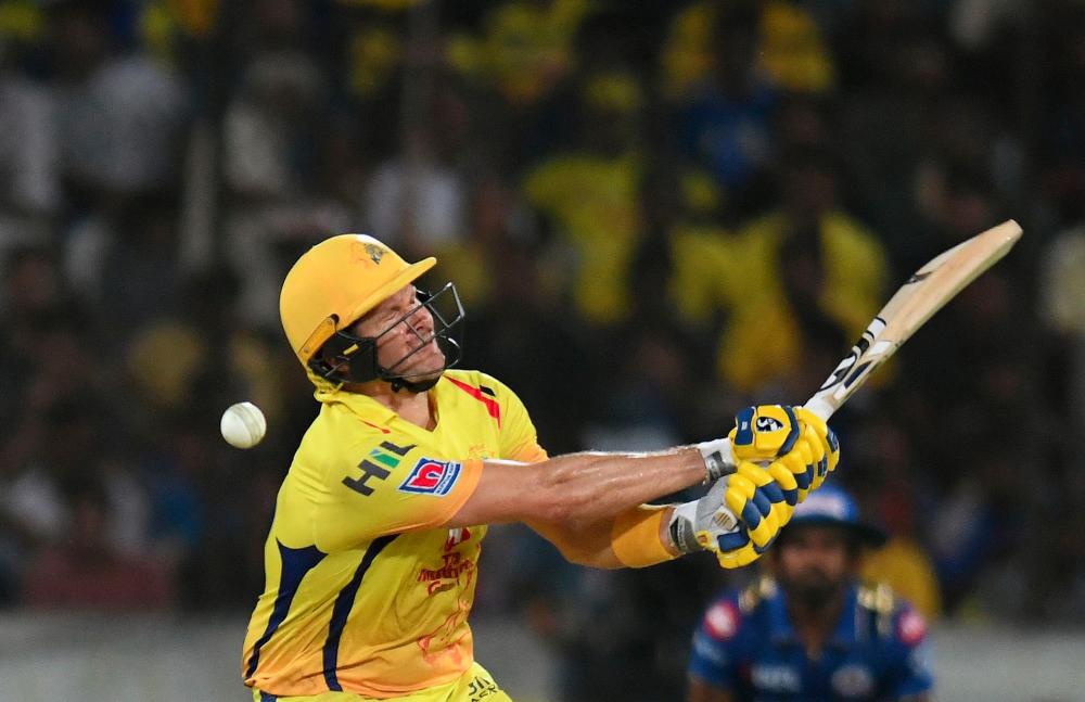 Chennai Super Kings cricketers Shane Watson plays a shot during the 2019 Indian Premier League (IPL) Twenty20 final cricket match between Mumbai Indians and Chennai Super Kings at the Rajiv Gandhi International Cricket Stadium in Hyderabad on May 12, 2019. — AFP