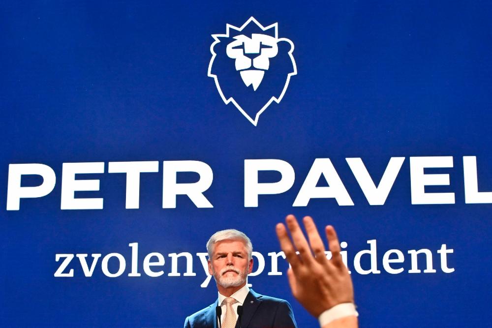 A supporter waves while presidential candidate Petr Pavel, former Chief of the General Staff of the Czech Army, looks on in Prague, Czech Republic on January 28, 2023, after becoming the fourth president of the Czech Republic according to official results. AFPPIX