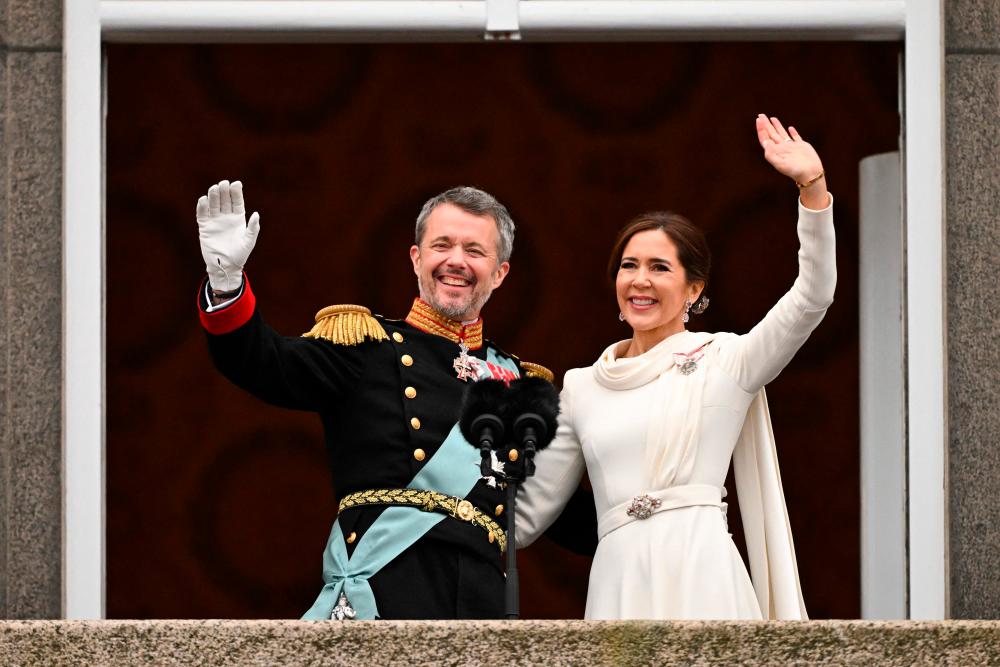 King Frederik X of Denmark and Queen Mary of Denmark (R) greet from the balcony of Christiansborg Palace in Copenhagen, Denmark on January 14, 2024/AFPpix