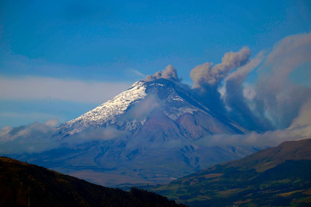 A plume of steam and gas billows from the Cotopaxi volcano as seen from Quito on June 13, 2023. AFPPIX