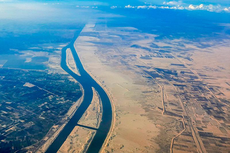 This picture taken on March 23, 2024 shows an aerial view of the new extension to the Suez Canal which was inaugurated in 2015 at al-Ferdan, north of Ismailia in northeastern Egypt. - AFPpix