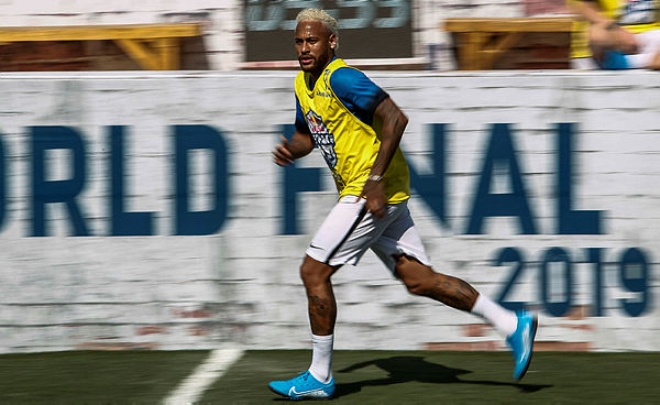 Brazilian football star Neymar runs during a five-a-side football tournament for his charity Neymar Junior Project Institute, in Praia Grande, Sao Paulo, Brazil, on July 13, 2019.