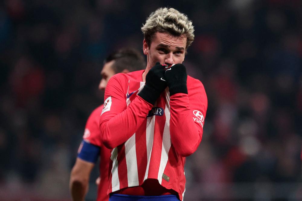 Atletico Madrid’s French forward #07 Antoine Griezmann celebrates after scoring his team’s third goal during the Spanish league football match between Club Atletico de Madrid and Getafe CF at the Metropolitano stadium in Madrid on December 19, 2023/AFPPix
