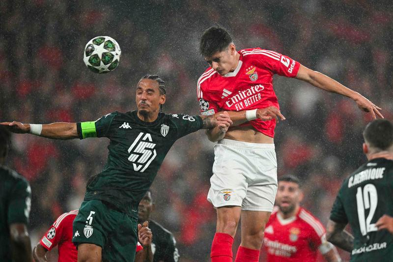 Monaco's German defender #05 Thilo Kehrer (L) and Benfica's Portuguese defender #04 Antonio Silva go for a header during the UEFA Champions League knockout phase play-off second leg football match between SL Benfica and AS Monaco at Luz stadium in Lisbon on February 18, 2025. - AFPPIX