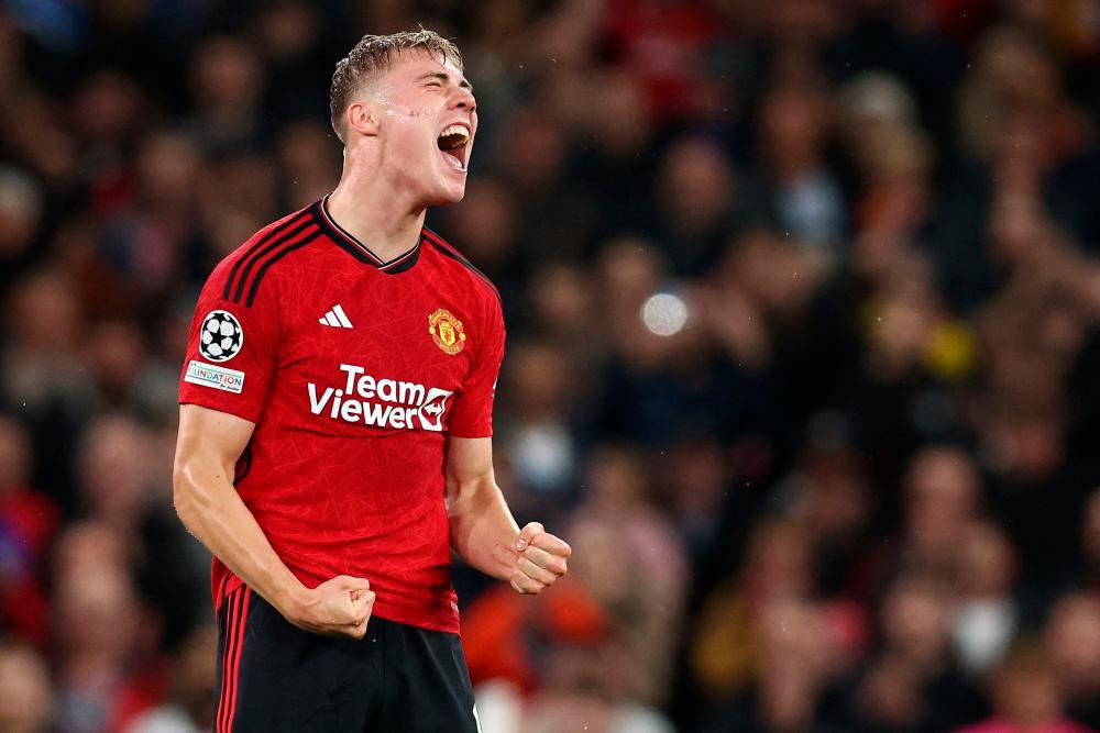Manchester United’s Danish striker #11 Rasmus Hojlund celebrates scoring the opening goal during the UEFA Champions league group A football match between Manchester United and Galatasaray at Old Trafford stadium in Manchester, north west England, on October 3, 2023/AFPPix