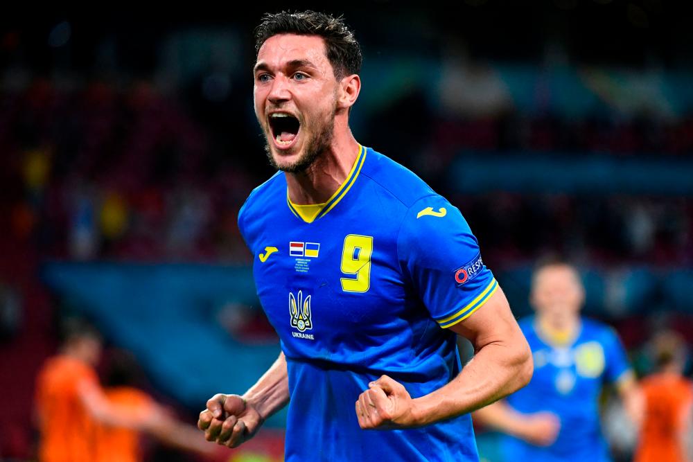 Ukraine’s forward Roman Yaremchuk celebrates after scoring the second goal during the UEFA EURO 2020 Group C football match at the Johan Cruyff Arena in Amsterdam. – AFPPIX