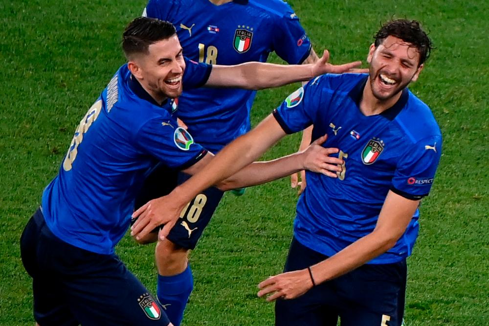 Italy’s Manuel Locatelli (right) celebrates with Jorginho after he scored the team’s second goal during the UEFA EURO 2020 Group A match against Switzerland at the Olympic Stadium in Rome on June 16, 2021. – AFPPIX