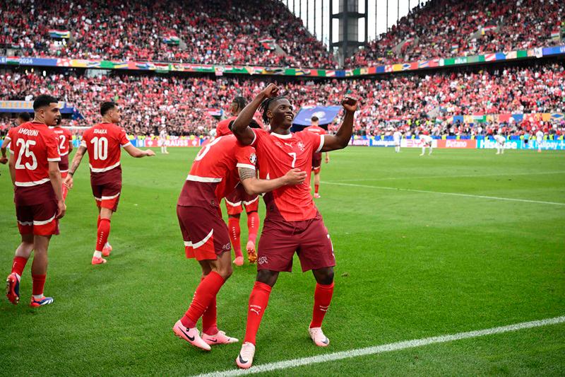 Switzerland's forward #07 Breel Embolo celebrates scoring his team's third goal with his teammates during the UEFA Euro 2024 Group A football match between Hungary and Switzerland at the Cologne Stadium in Cologne on June 15, 2024. - AFPpix