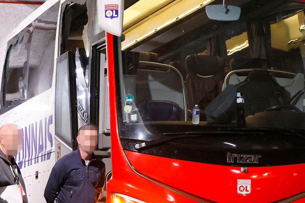 A photograph taken at Stade Velodrome in Marseille, southern France on October 29, 2023, shows Lyon’s team bus, with one window (L) completely broken and another damaged, after the bus was stoned as it entered the Stade Velodrome ahead of the French L1 football match between Olympique Marseille (OM) and Olympique Lyonnais (OL)/AFPpix