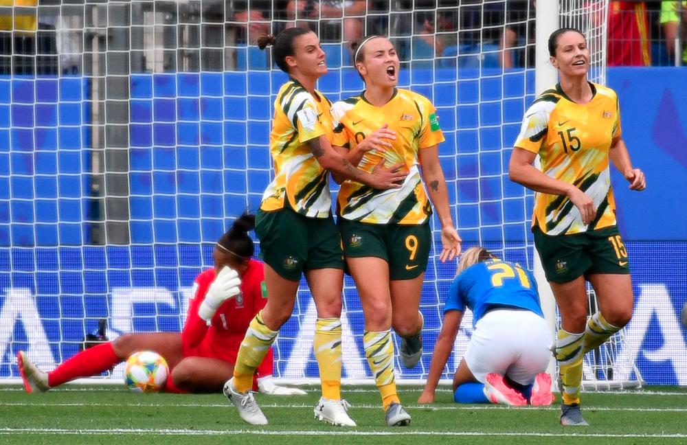 Australia’s forward Caitlin Foord (C) celebrates after scoring a goal during the France 2019 Women’s World Cup Group C football match between Australia and Brazil, on June 13, 2019, at the Mosson Stadium in Montpellier, southern France. — AFP