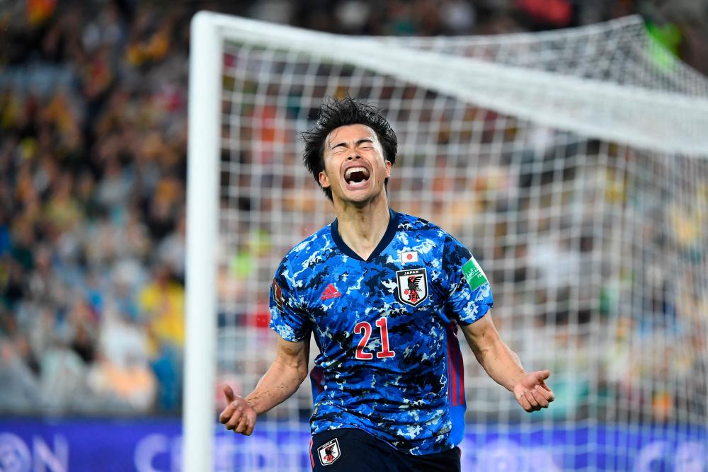Japan’s Kaoru Mitoma celebrates after scoring during the Qatar World Cup 2022 Asian zone Group B qualification football match between Australia and Japan at Stadium Australia in Sydney on March 24, 2022. AFPPIX