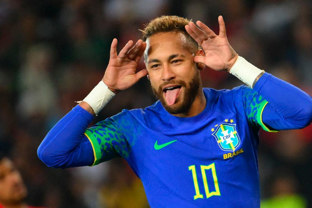 Brazil's forward Neymar celebrates scoring his team's third goal during the friendly football match between Brazil and Tunisia at the Parc des Princes in Paris on September 27, 2022. AFPPIX