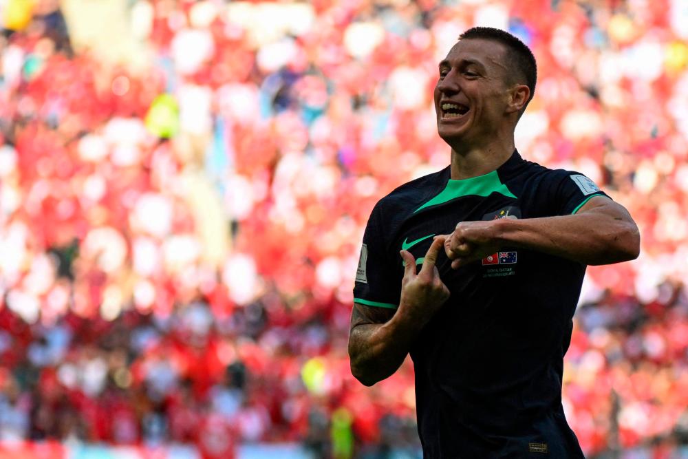 Australia’s forward #15 Mitchell Duke celebrates after scoring his team’s first goal during the Qatar 2022 World Cup Group D football match between Tunisia and Australia at the Al-Janoub Stadium in Al-Wakrah, south of Doha on November 26, 2022/AFPPix