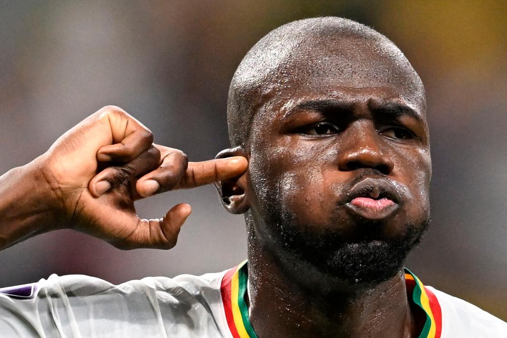 Senegal’s defender #03 Kalidou Koulibaly celebrates scoring his team’s second goal during the Qatar 2022 World Cup Group A football match between Ecuador and Senegal at the Khalifa International Stadium in Doha on November 29, 2022. AFPPIX