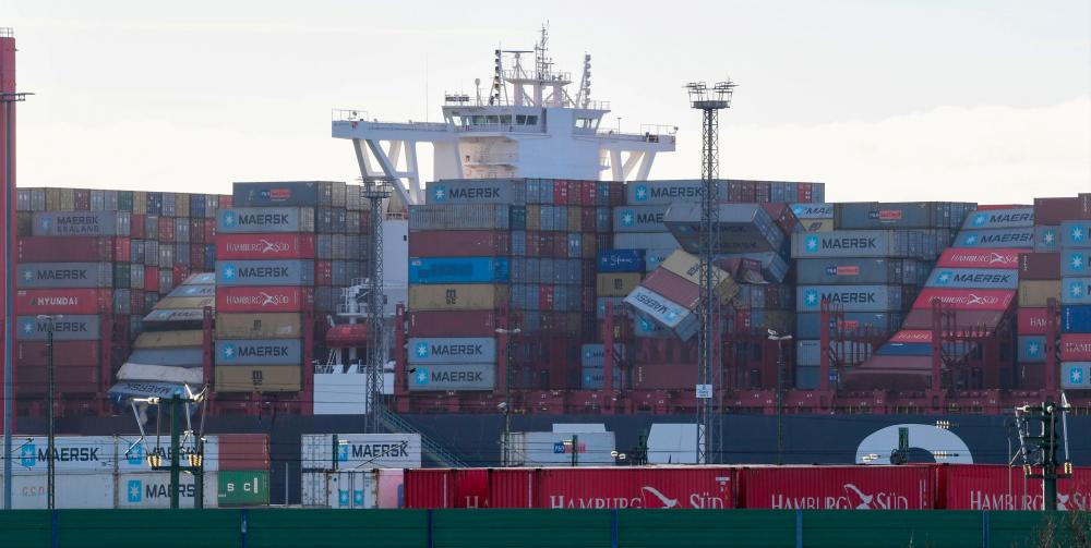 The container carrier MSC Zoe lies in the harbour of Bremerhaven, northern Germany, on Jan 3, 2019. The cargo ship caught on Jan 2, 2019 in rough North Sea weather lost at least 270 containers, including some holding potentially dangerous substances, the Dutch and German coastguards said. — AFP