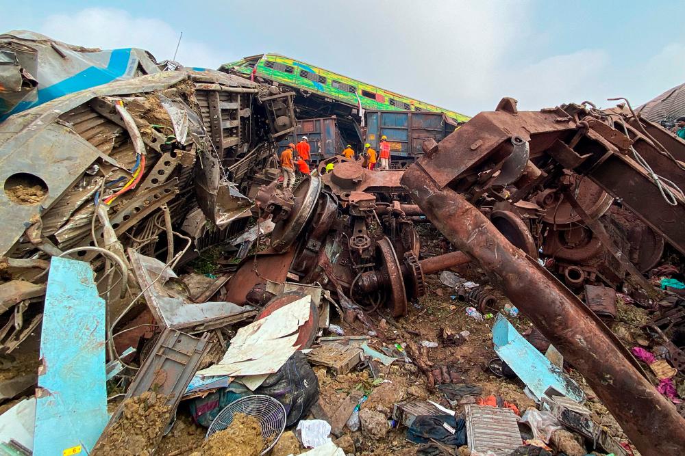 Rescue workers search for survivors at the accident site of a three-train collision near Balasore, about 200 km (125 miles) from the state capital Bhubaneswar, on June 3, 2023. AFPPIX