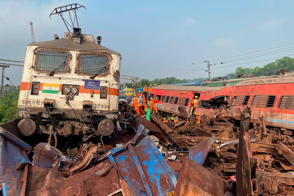 Damaged carriages are seen at the accident site of a three-train collision near Balasore, about 200 km (125 miles) from the state capital Bhubaneswar, on June 3, 2023. AFPPIX