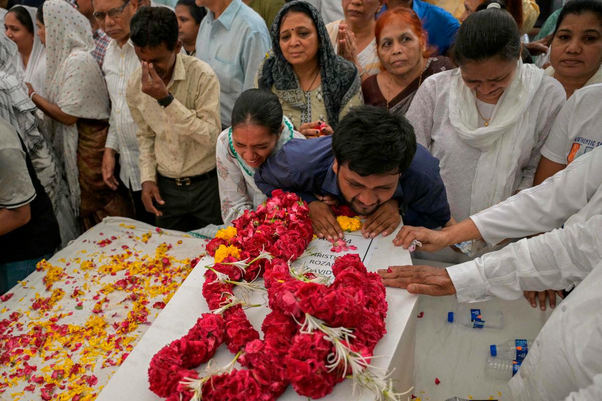 Relatives mourn near the coffins of victims, who were killed in the Air India flight crash, during a special prayer before a funeral ceremony in Ahmedabad on June 15, 2025. AFPpix