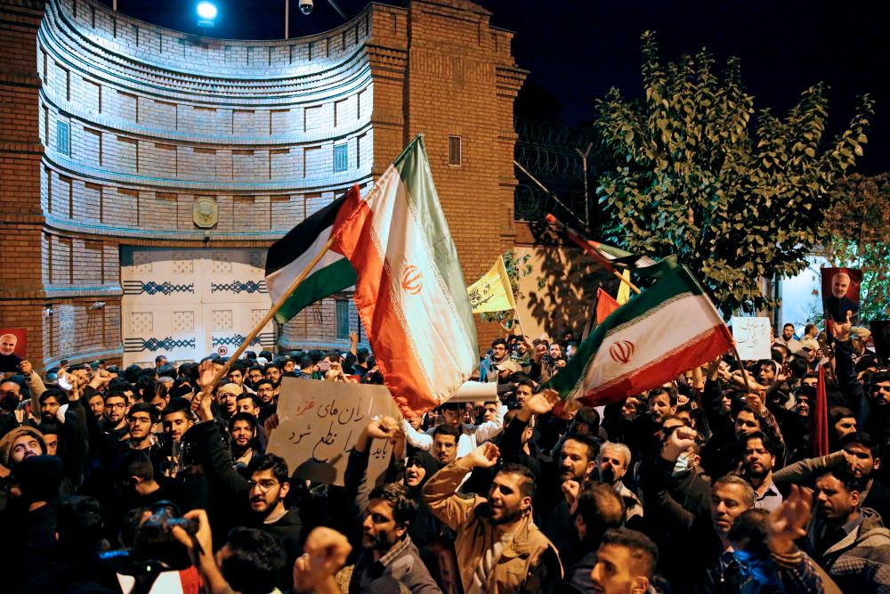 Iranian students and demonstrators protest in support of Palestinians in front of the French embassy in Tehran, early morning on October 18, 2023. AFPPIX