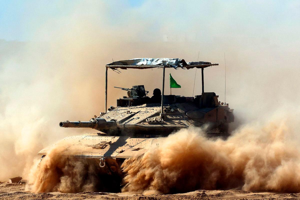 Israeli troops deploy by Israel’s border fence with the Gaza Strip on July 10, 2025, amid the ongoing war with the Palestinian militant movement Hamas. Photo by Jack GUEZ / AFP