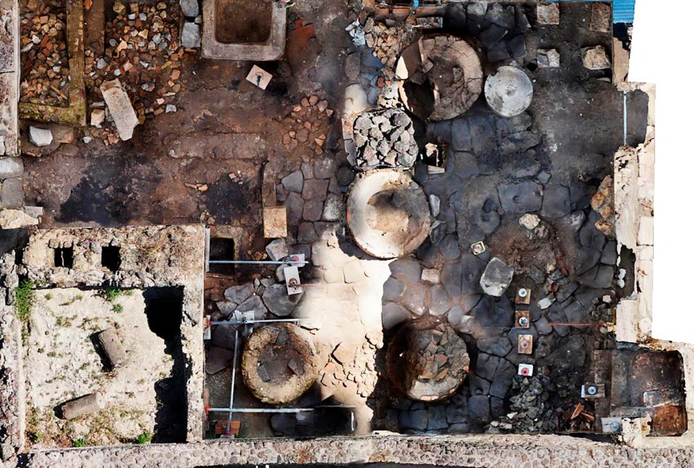 This handout picture released on December 8, 2023 by the Pompeii archaeological park, shows the Regio IX area of the site where a prison-bakery has been discovered, announced the archaeological park on the same day/AFPpix