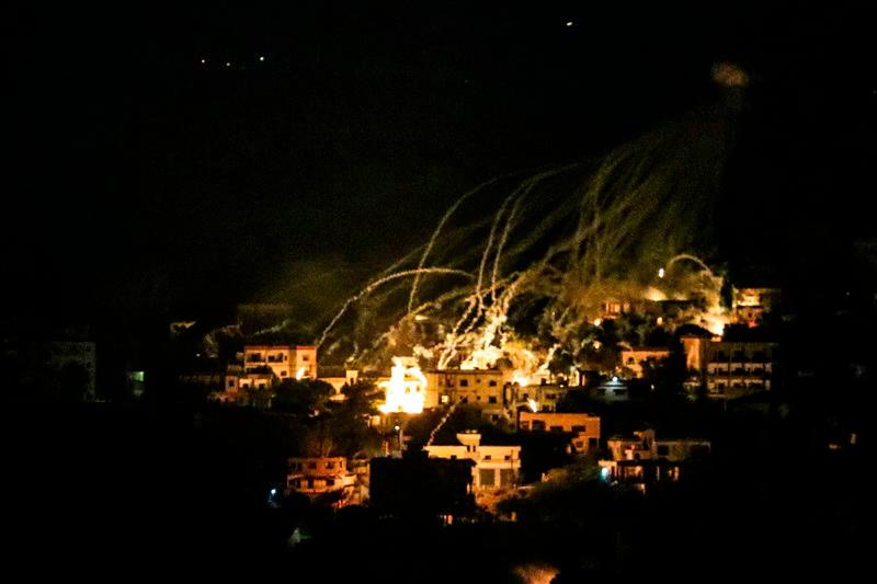 A picture taken from the area of Marjeyoun in southern Lebanon shows explosions over buildings in the town of Khiam, during Israeli bombardment on October 31, 2024, amid the ongoing war between Israel and Hezbollah. - AFPpix