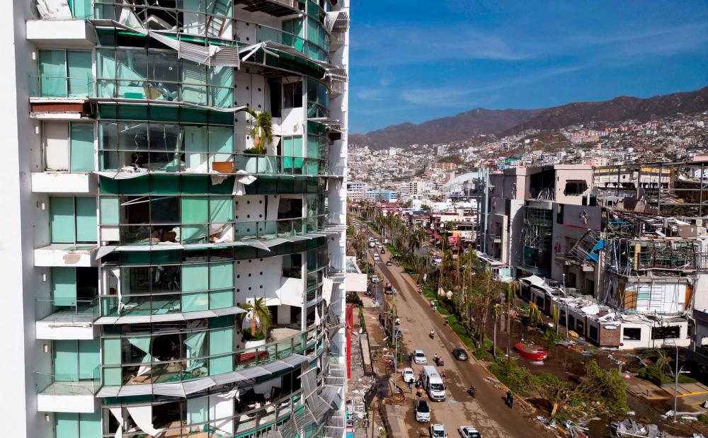 View of a building partially destroyed after the passage of Hurricane Otis in Acapulco, Guerrero State, Mexico, on October 26, 2023. AFPPIX