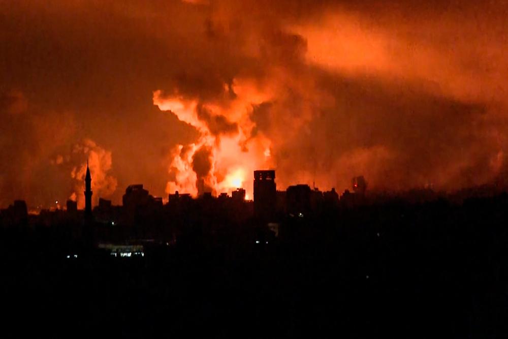This image grab from an AFP TV footage shows balls of fire and smoke rising above Gaza City during an Israeli strike on October 27, 2023, as battles between Israel and the Palestinian Hamas movement continue. AFPPIX