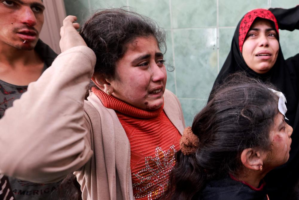 Children injured in Israeli bombardment, await treatment at the al-Najjar hospital in Rafah in the southern Gaza Strip on March 1, 2024, amid ongoing battles between Israel and the Palestinian Hamas movement. - AFPPIX
