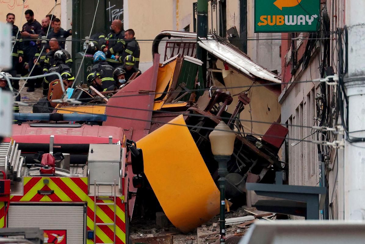 Police and firefighters work on the site of a funicular railway accident in Lisbon, on September 3, 2025. - AFPPIX