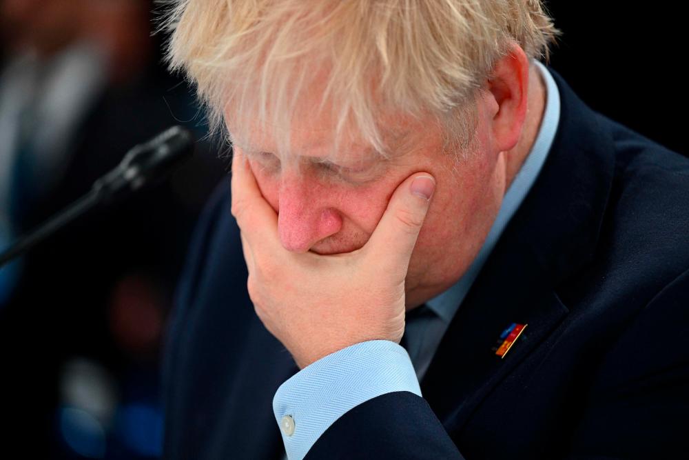 Britain’s Prime Minister Boris Johnson gestures ahead of a meeting of The North Atlantic Council during the NATO summit at the Ifema congress centre in Madrid, on June 30, 2022. AFPPIX