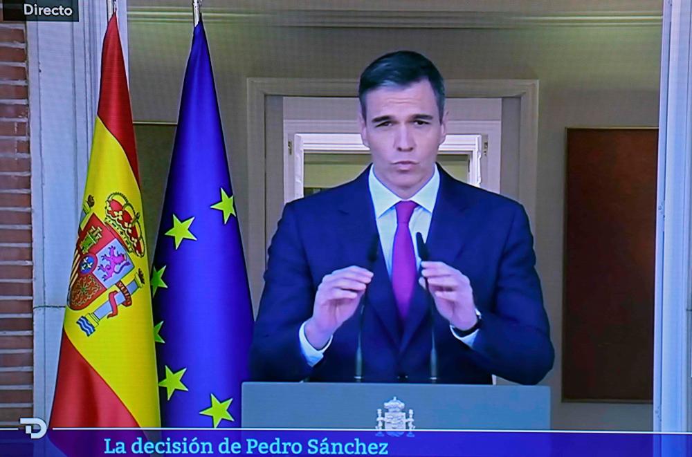 Picture of a TV screen taken on April 29, 2024 in Madrid shows Spain Prime Minister Pedro Sanchez announcing that he stays as Prime Minister despite political harassment/AFPPix