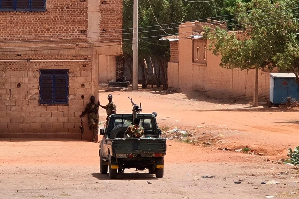 Sudanese army soldiers rest next to a building in Khartoum on May 25, 2023, AFPPIX