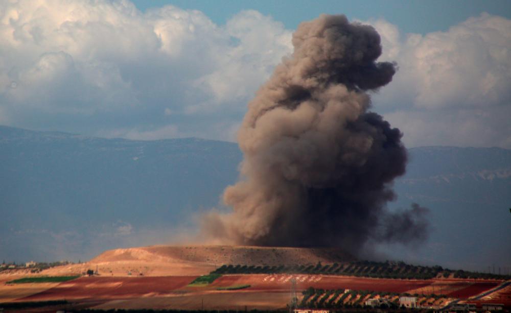 Smoke rises near the Syrian village of Kafr Ain in the southern countryside of Idlib province after an airstrike on Sept 7, 2018. — AFP