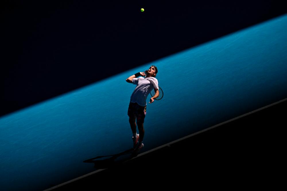 Greece’s Stefanos Tsitsipas serves against Russia’s Karen Khachanov during their men’s singles semi-final match on day twelve of the Australian Open tennis tournament in Melbourne on January 27, 2023. AFPPIX